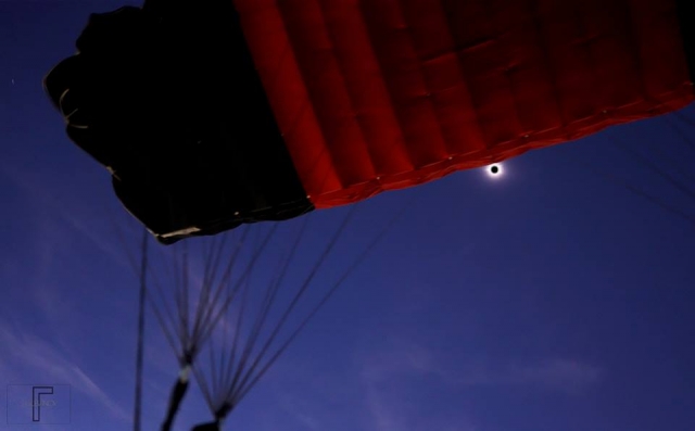 View from under parachute during solar eclipse at totality